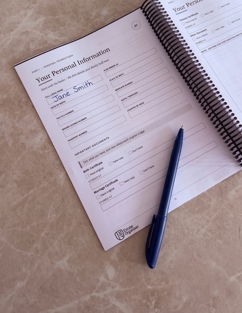 A page of The Estate Organiser filled in by hand, with a pen resting on it